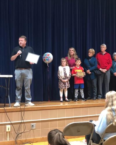 Jason Krueger receives award at Park Middle School.